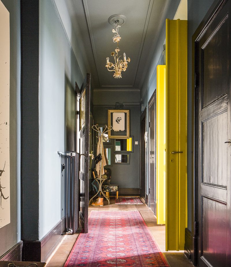 Narrow corridor design in gray colors.