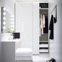The glossy surfaces of the wardrobe in the hallway