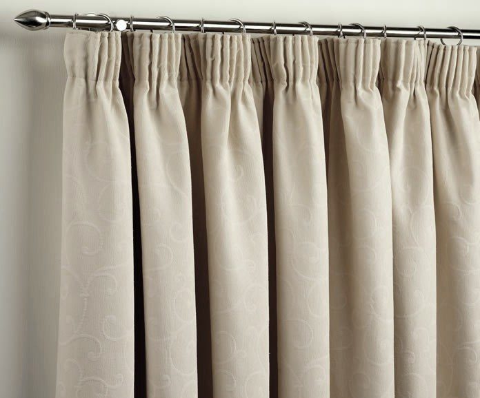 Dark beige curtains with ring mounts