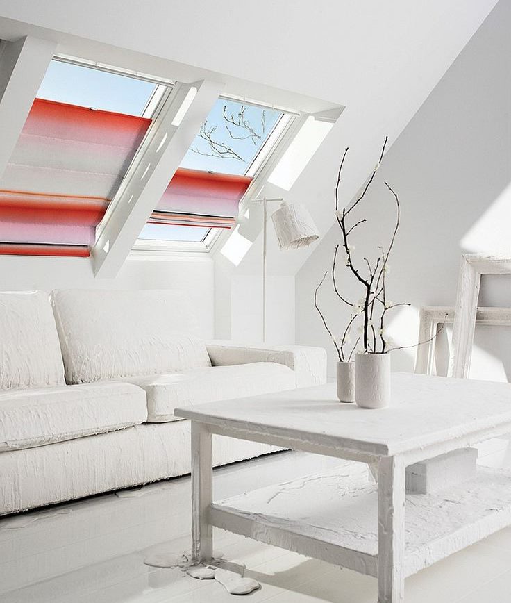 Attic living room design with roman blinds