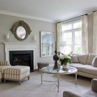 Large mirror above the fireplace in the living room