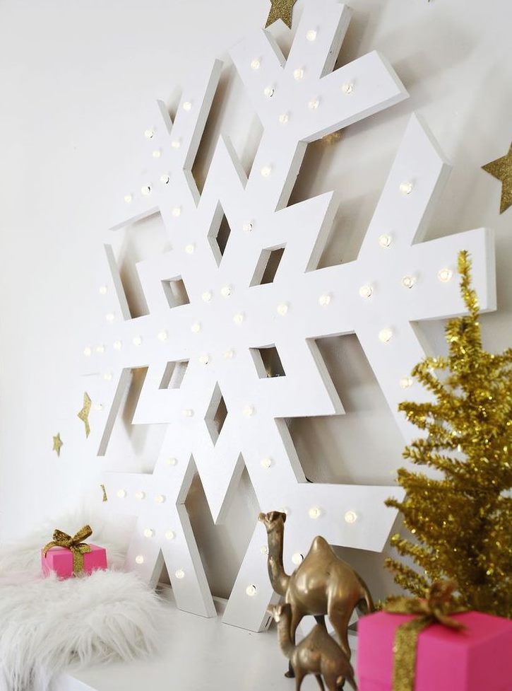 Large snowflake with lighting on the dresser in the living room
