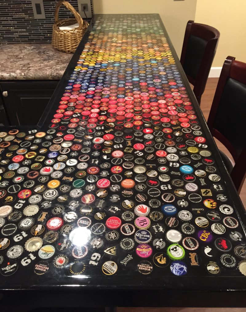 Decorating the countertops of the bar counter with beer lids