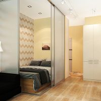 Bed behind a sliding glass partition