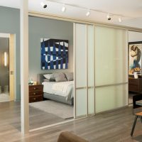 Zoning the room with a sliding partition