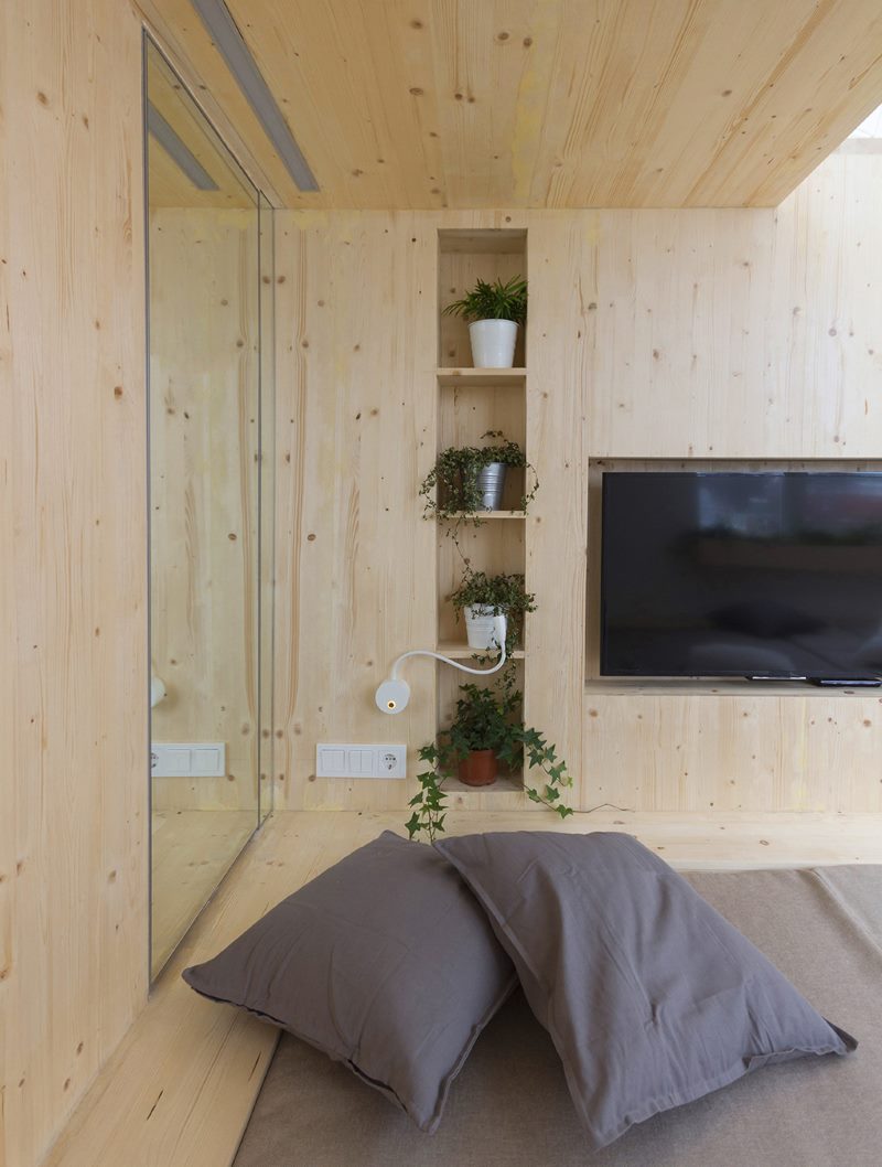 Wall and ceiling decoration of the bedroom with pine imitation of timber