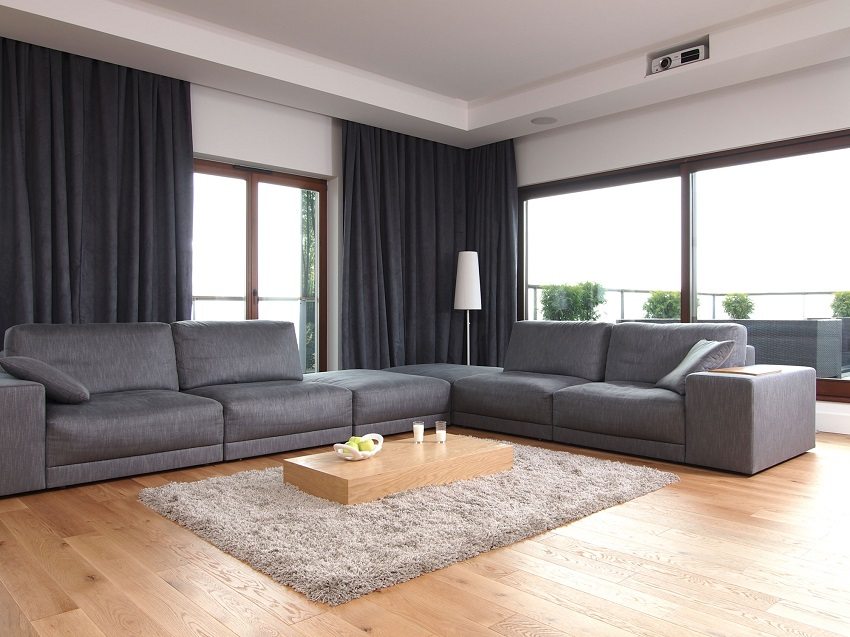 Gray upholstered furniture on a light laminate floor