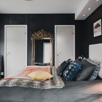 Modern bedroom with black walls