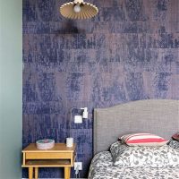 Accented bedroom wall with artificially aged surface