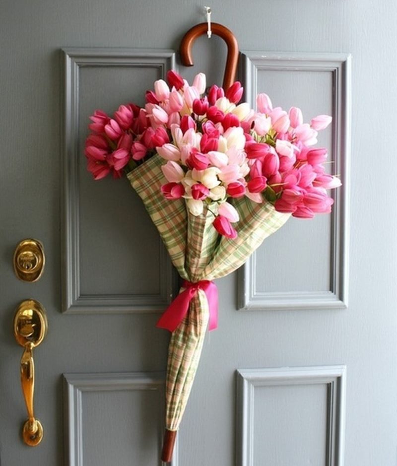 Decoration of the front door with a bouquet of tulips