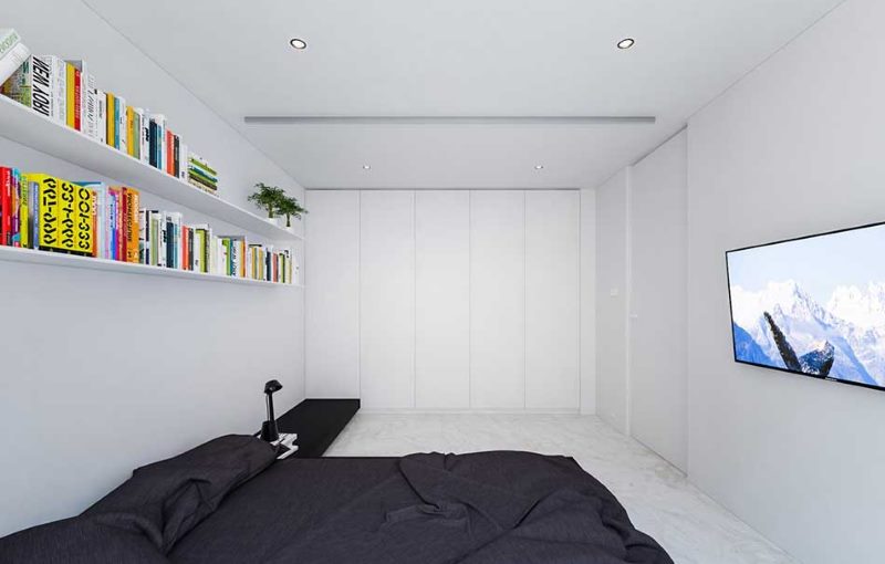 Long open shelves on the wall of a narrow bedroom