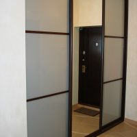 Sliding mirrored cabinet doors