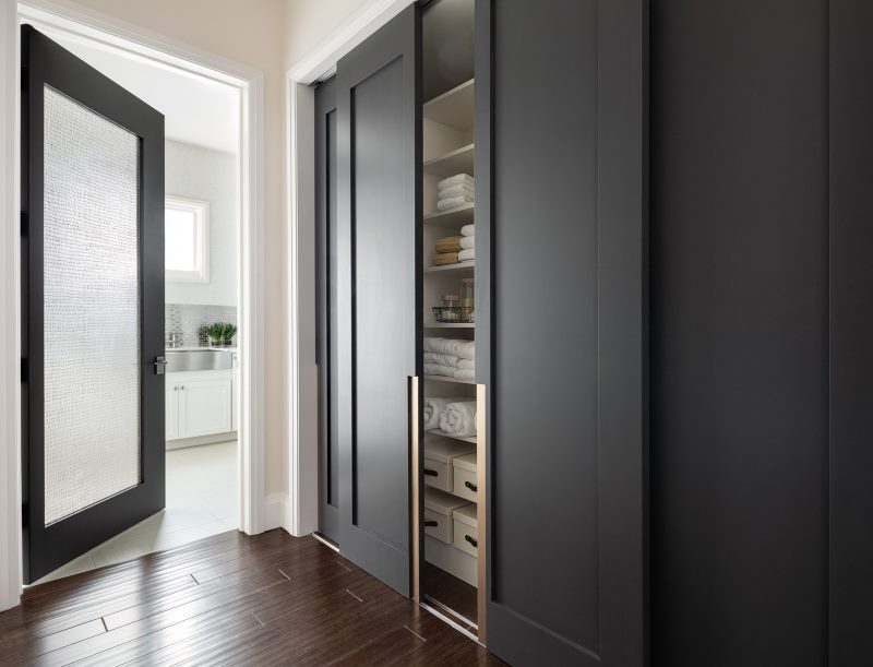 The dark gray doors of the built-in wardrobe