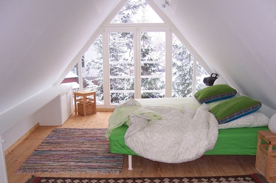 Green bed in the attic bedroom