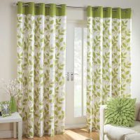 Curtains with leaves and a green stripe.
