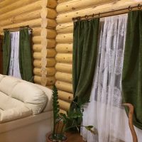 Bright sofa in a log cabin