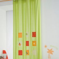 Red and orange squares on light green curtains