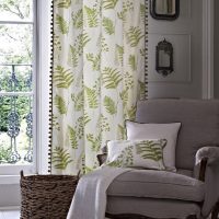 White curtains with green twigs