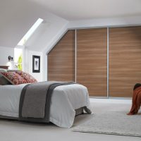 Brown wall in a white bedroom