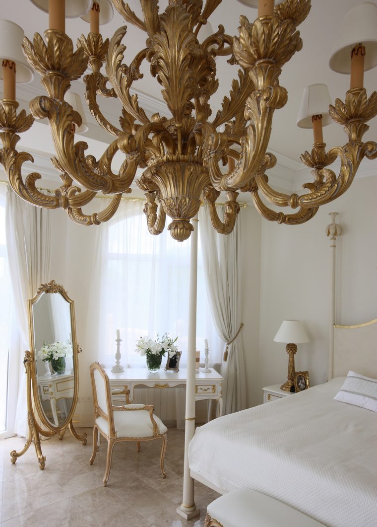 Golden chandelier in a classic bedroom