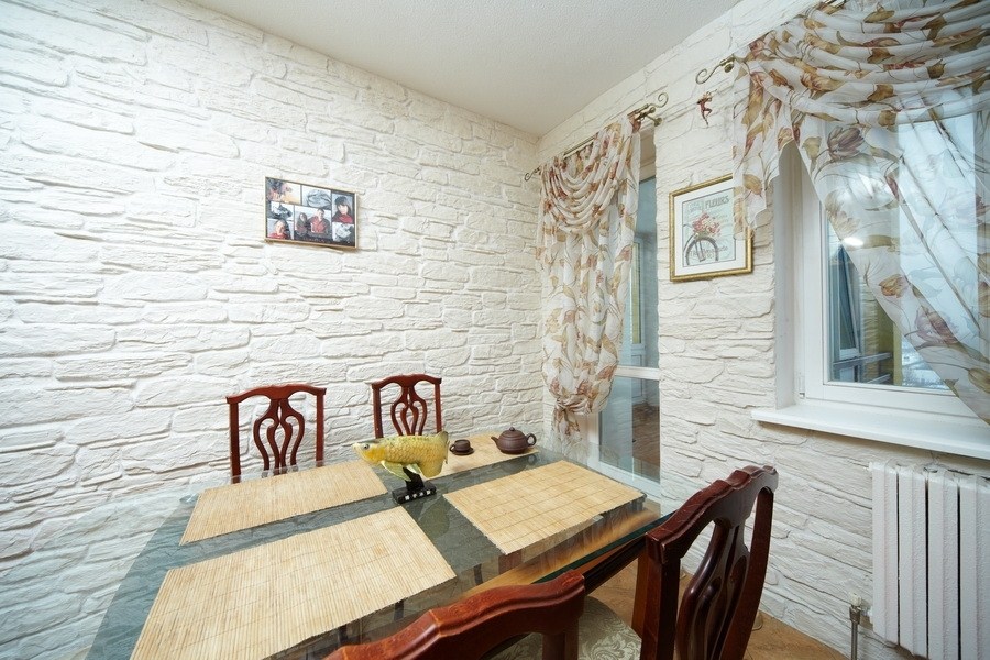 Kitchen interior with white stone on the walls