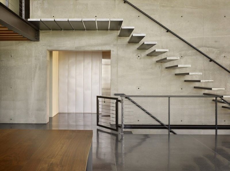 Gray concrete staircase in an industrial interior