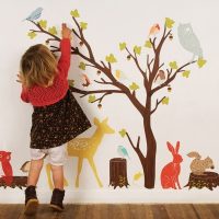Decorating the wall with the hands of a child