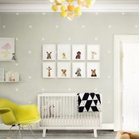 Collection of children's drawings over the crib for a newborn