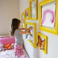 Daughter's drawings in yellow frames