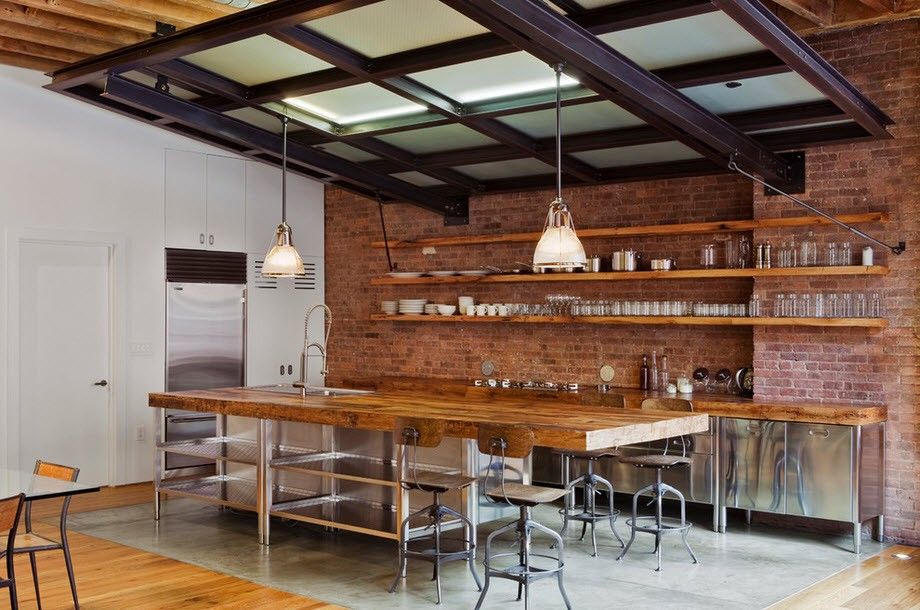 Long wooden shelves on the brick wall of the kitchen