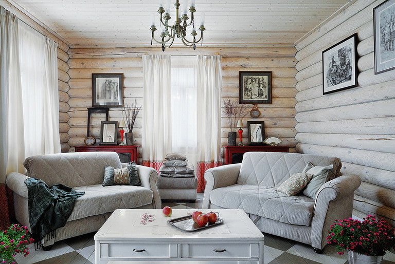 Progetto di un soggiorno di una casa di campagna con due divani
