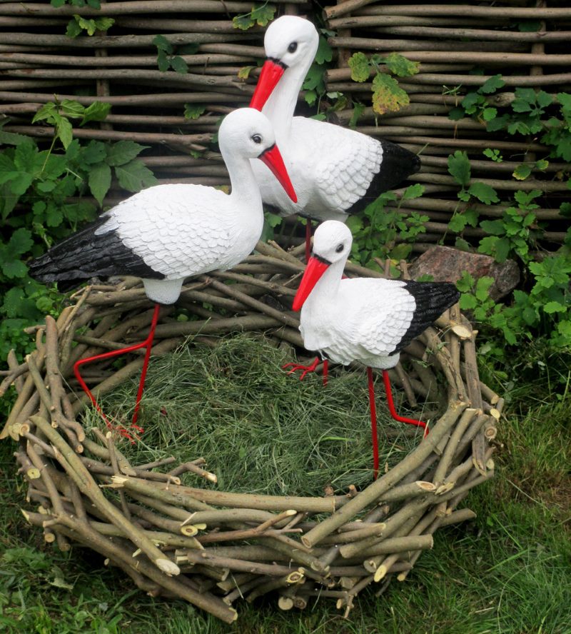 Decorative composition of stork figures