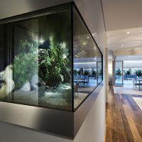 Design a living room with a corner aquarium