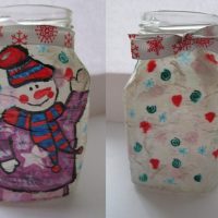 Drawing of a snowman with a scarf on the surface of the can