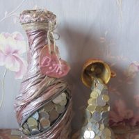 Decor of an old bottle with coins