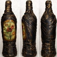 An example of a bottle decor with decoupage and cloth