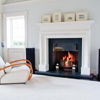 White living room with real fireplace