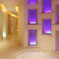 Niches with lighting in the lobby of a private house