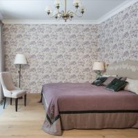 Stylish bedroom with floral wallpaper