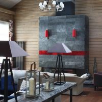 Red accents on the gray fireplace mantel