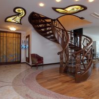 Spiral staircase made of wood in the lobby of a private house