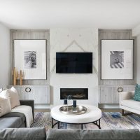 Large paintings in niches of the living room wall