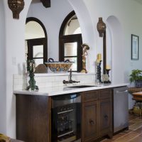 Wooden furniture in the kitchen with an arch