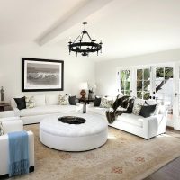 White living room with large windows