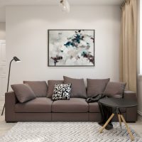 Decorating a wall above a sofa with a painting