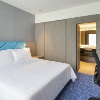 Design a small bedroom in gray tones