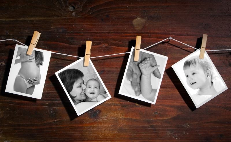 Black and white photo on wooden clothespins.