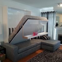 Folding bed with hanging table