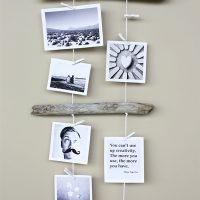 Pendant of photographs on wooden sticks