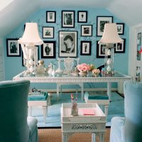 Turquoise wall with photos in the attic room